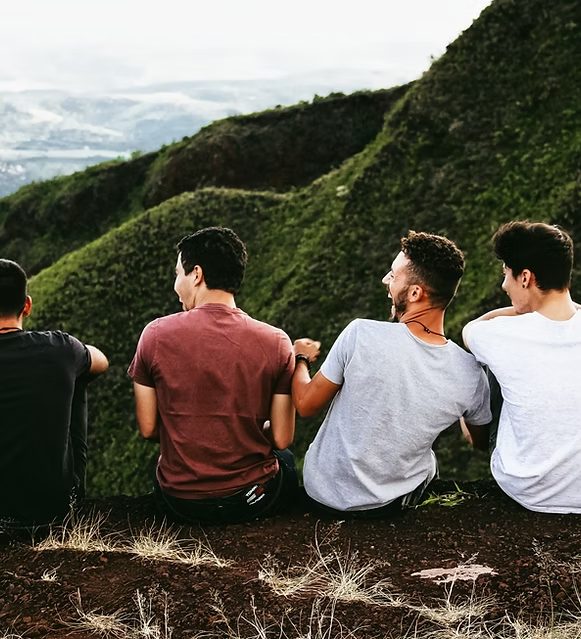Friends supporting one another outdoors, reflecting the community around mental health