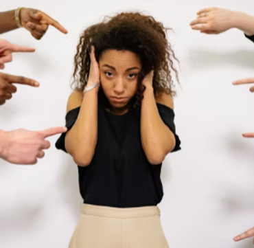 Woman facing outside judgment — the isolation mental health stigma can create